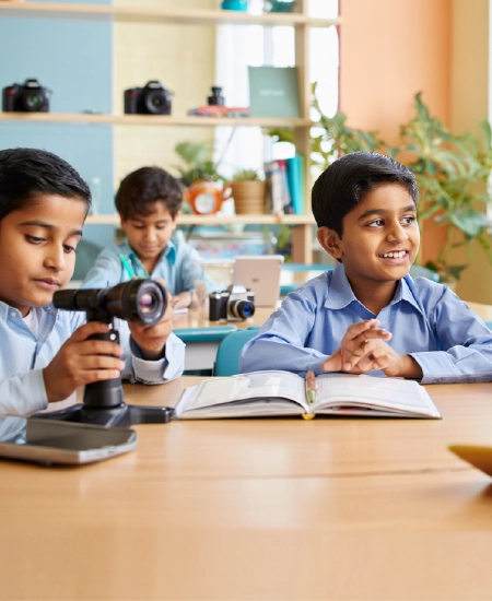 Boys using camera equipment