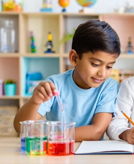 Boy performing chemistry experiment